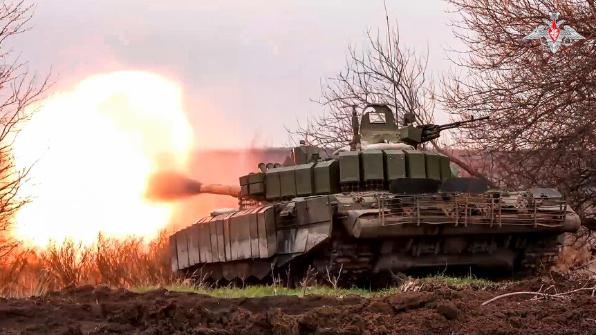 A Russian tank fires into the distance 