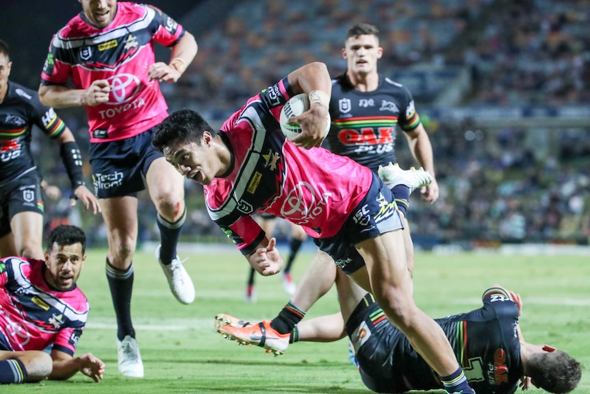 Murray Taulagi scores for the Cowboys against the Panthers