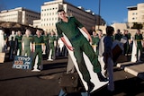 An Israeli demonstrator carries a cardboard cut-out of captured Israeli soldier Gilad Shalit during a protest in Jerusalem