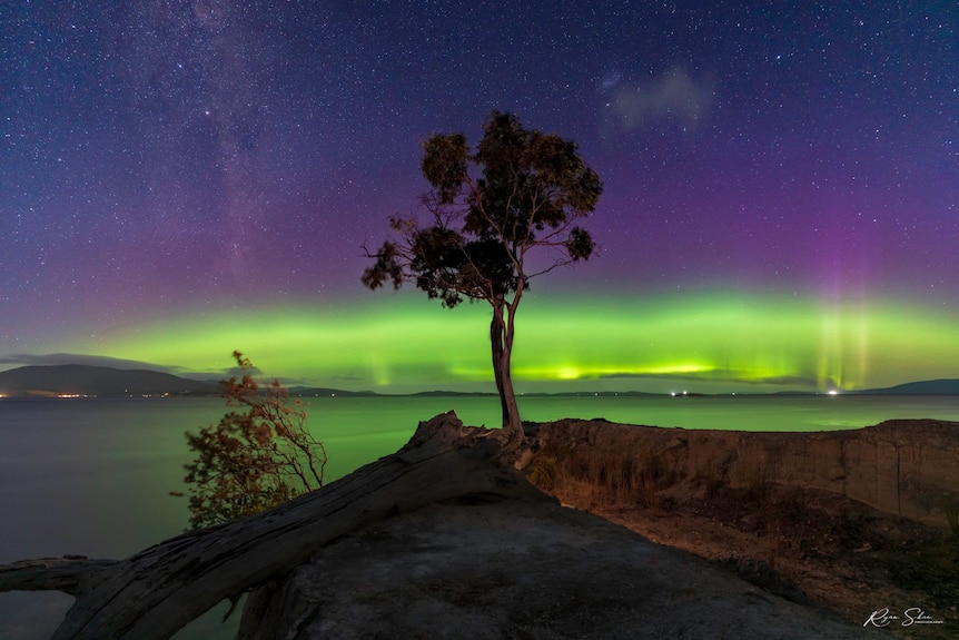 Green, purple and blue sky of an aurora australis in Tasmania.