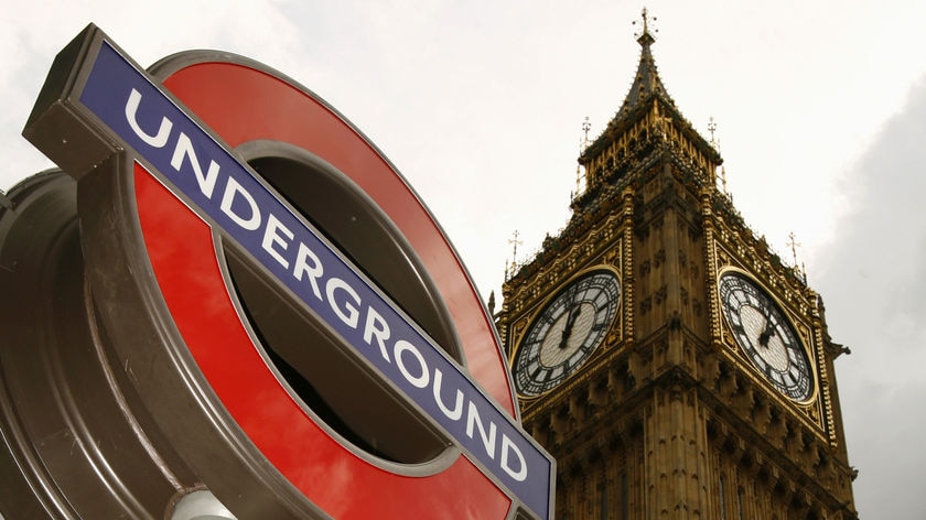 A London underground sign is pictured below Big Ben, London on September 3, 2007.