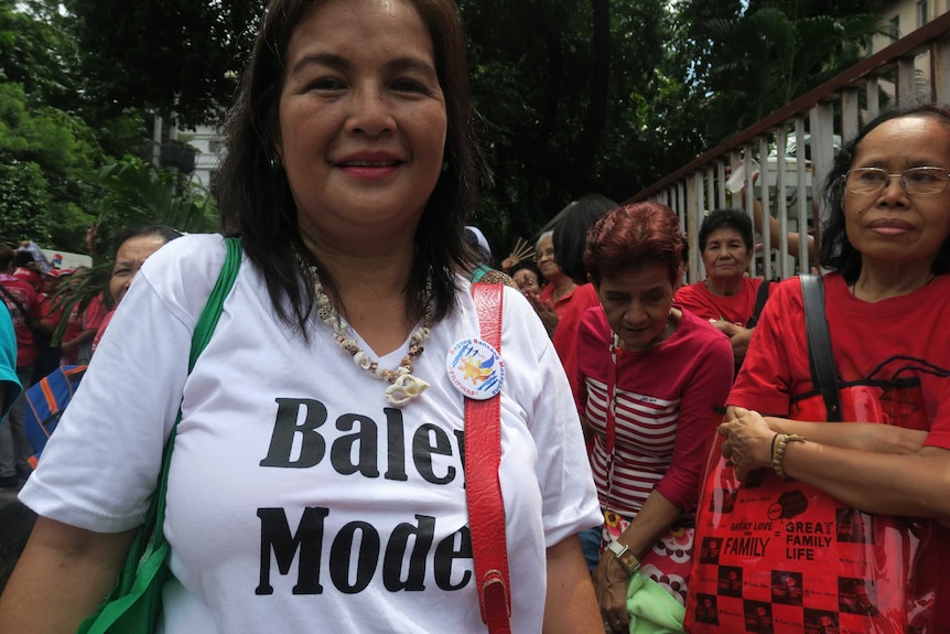 Pro Marcos protester, Mila, shows her support for national hero burial of former president Ferdinand Marcos.