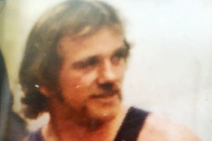 A photo of Mick Roberts wearing a black singlet.