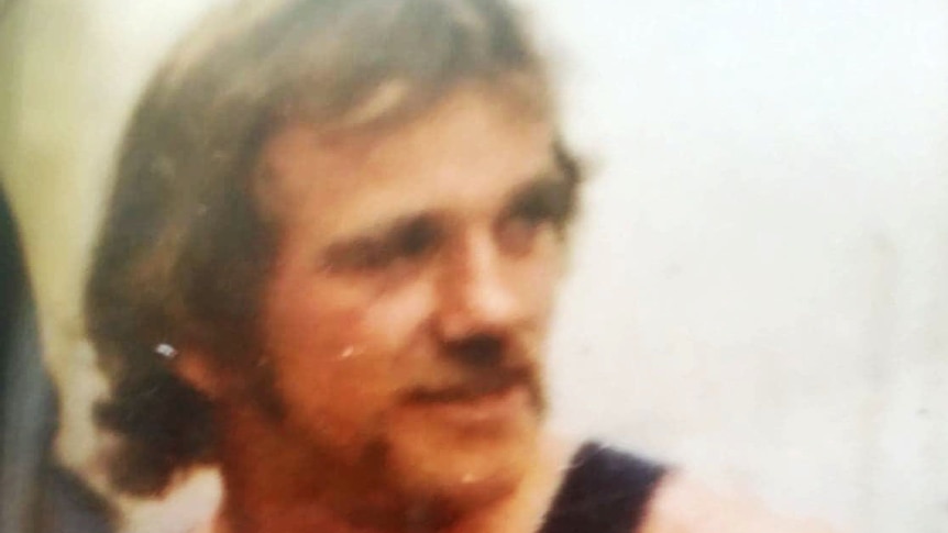 A photo of Mick Roberts wearing a black singlet.