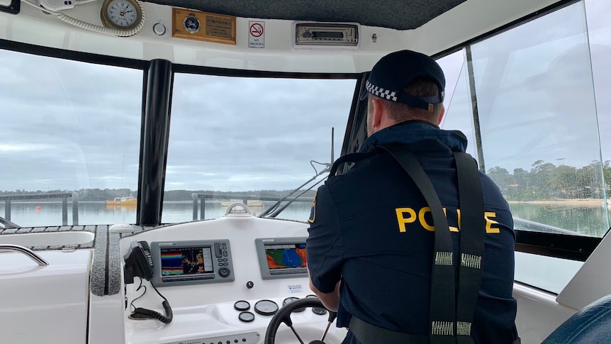 Tasmania water police officer Will Broadbridge on a boat.