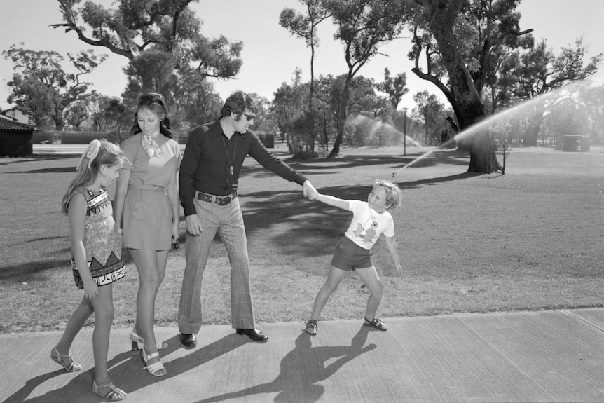 A black and white image of a family in a park in Crestwood