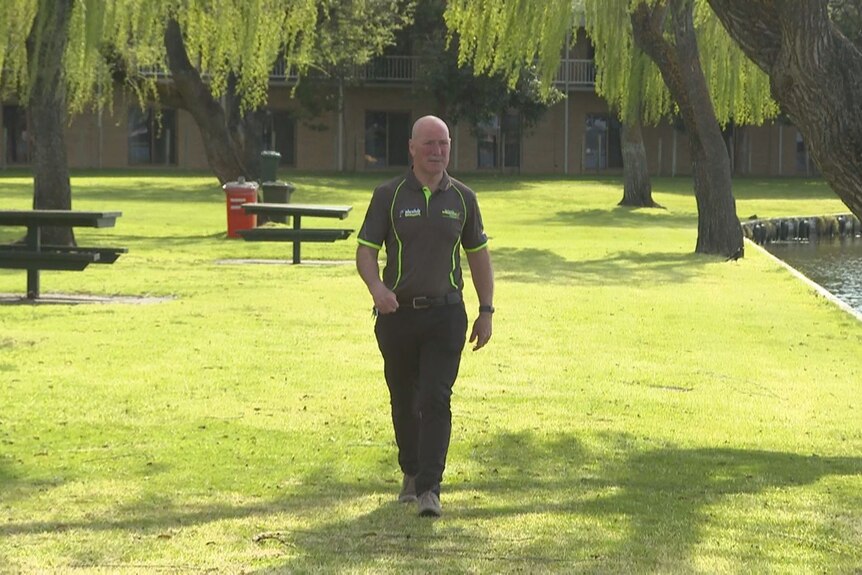 Peter Duncan walks along the  foreshore of the Mulwala Ski Club show arena