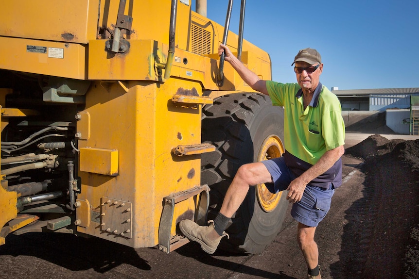 Adolf May climbs down from a loader at Rocky Point's facility on the Gold Coast.