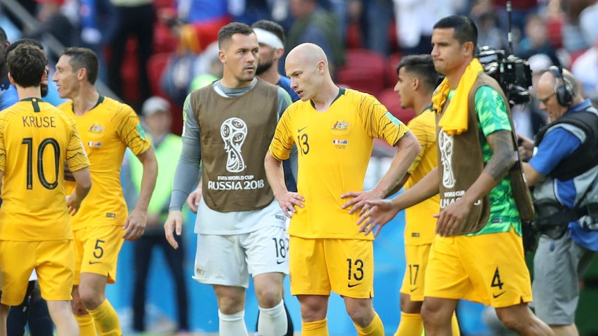 Socceroos players look downcast after World Cup loss