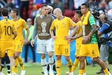 Socceroos players look downcast after World Cup loss