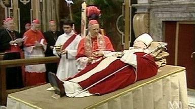 Mourners pay their respects to Pope John Paul II.