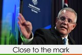 Scott Morrison pointing at a graph verdict close to the mark three quarters green one orange