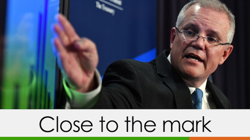 Scott Morrison pointing at a graph verdict close to the mark three quarters green one orange