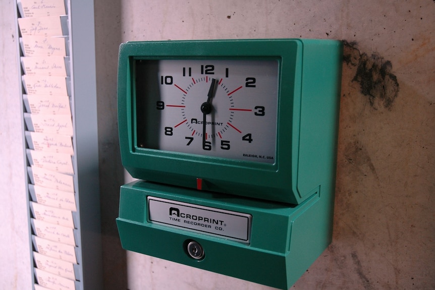 A vintage time-punch clock where workers would register when they start and finish at work.
