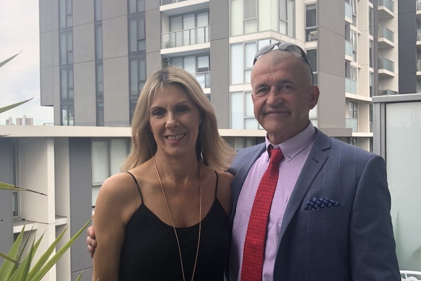 A man and a woman dressed up for an occasion.