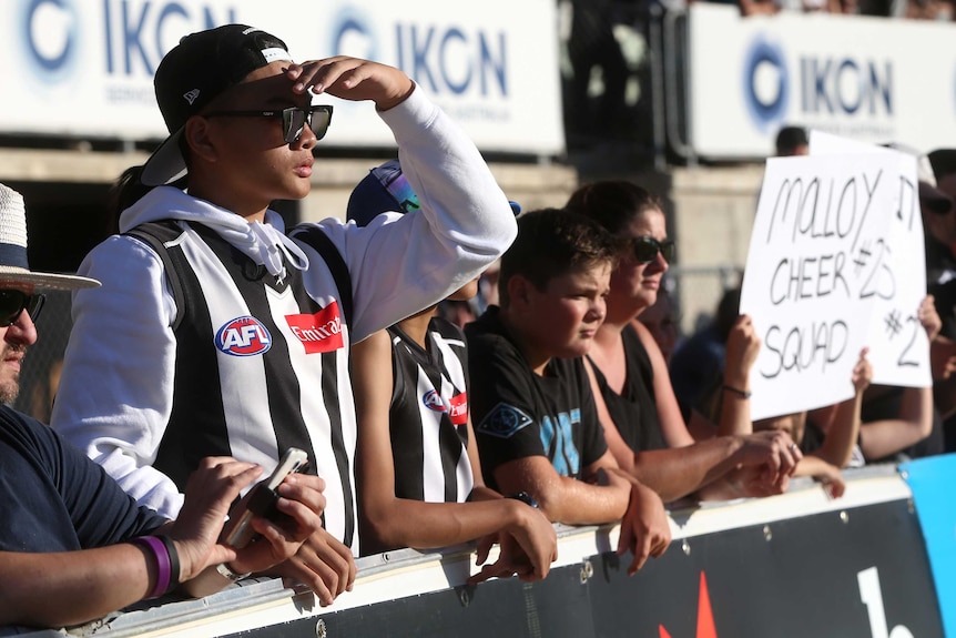 Collingwood supporters on the fence at Princes Park ahead of the opening match of the AFLW 2018 season.