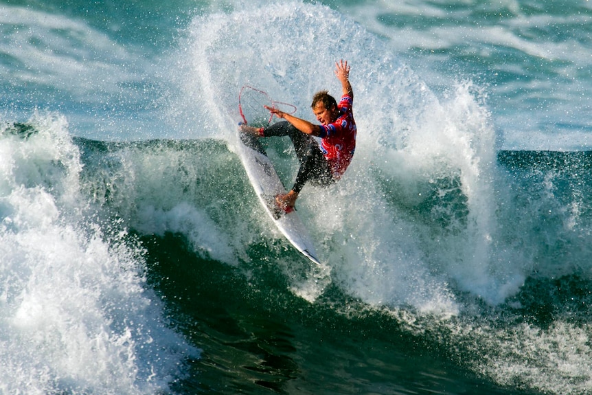Taj Burrow surfs at Bells Beach.
