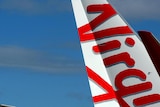 Two planes sport the new branding for the Virgin Australia airline on the tarmac at Sydney Airport