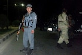 Afghan security forces keep watch at the site of an attack in Kabul.
