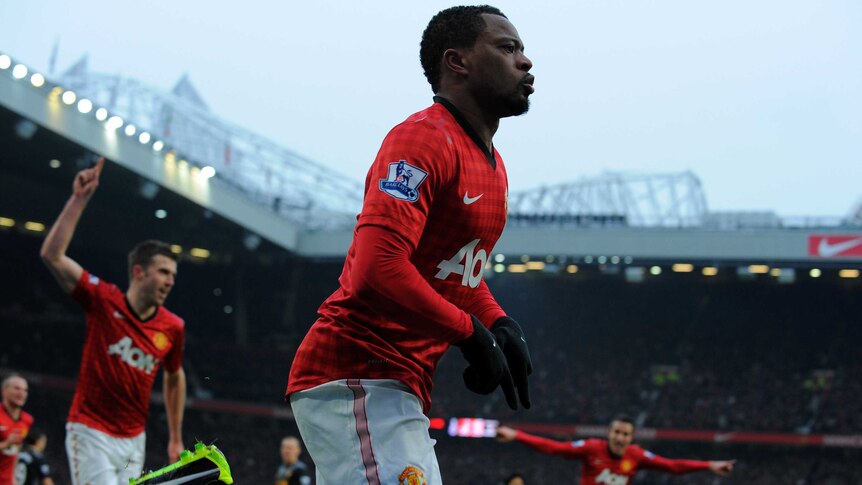 Liverpool beaten ... Patrice Evra celebrates his team's second goal against Liverpool at Old Trafford.