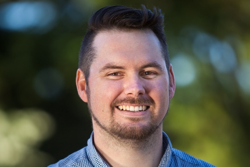 Smiling headshot of Dr Jake Whitehead.