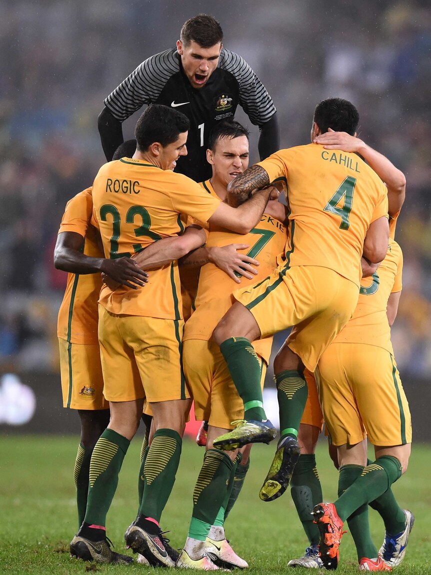 Socceroos celebrate Leckie's late winner