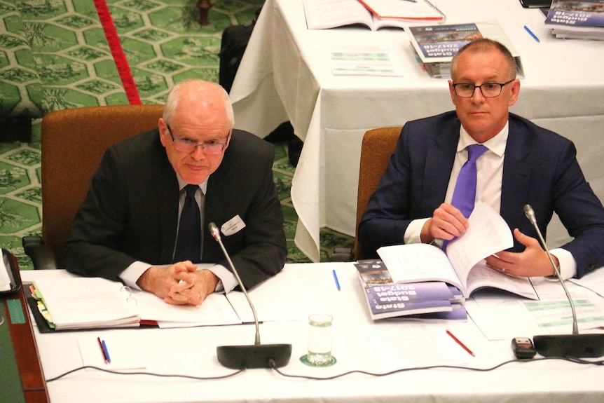 Auditor-General Andrew Richardson sits next to SA Premier Jay Weatherill.