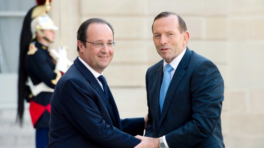 French president Francois Hollande (L) welcomes Prime Minister Tony Abbott prior to a meeting at the Elysee Palace.