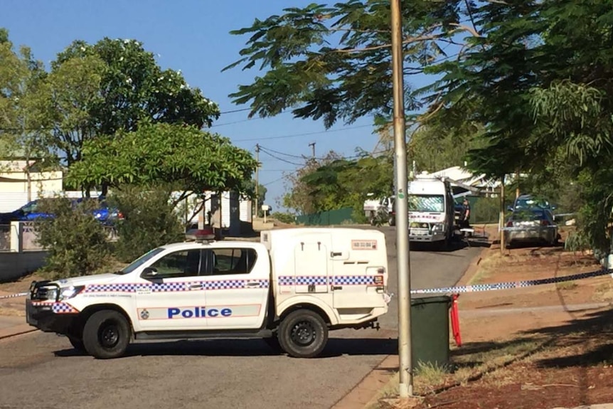 Police cars and forensics in a closed street at the scene of a suspicious death of a man in Happy Valley at Mount Isa.