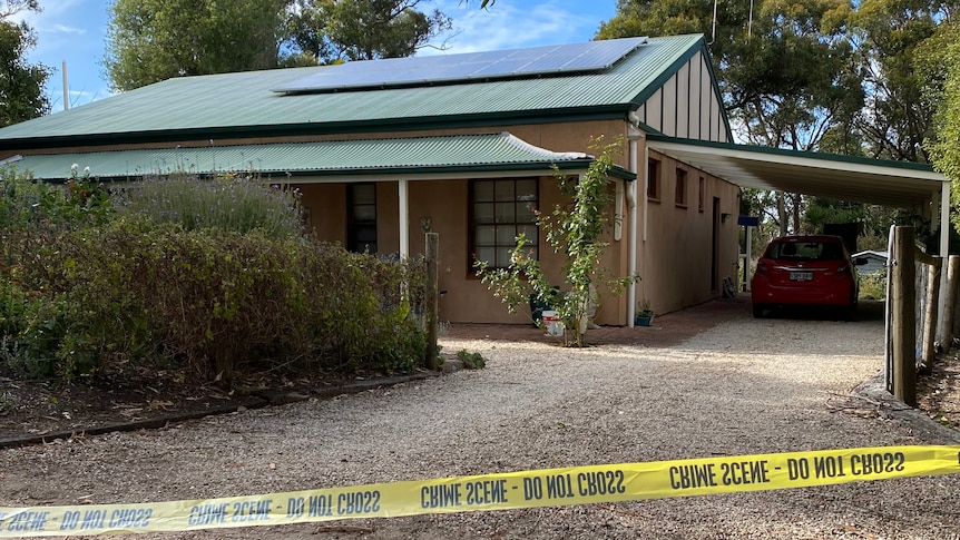 A house with police tape in front of it