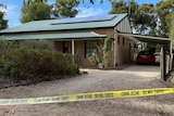 A house with police tape in front of it