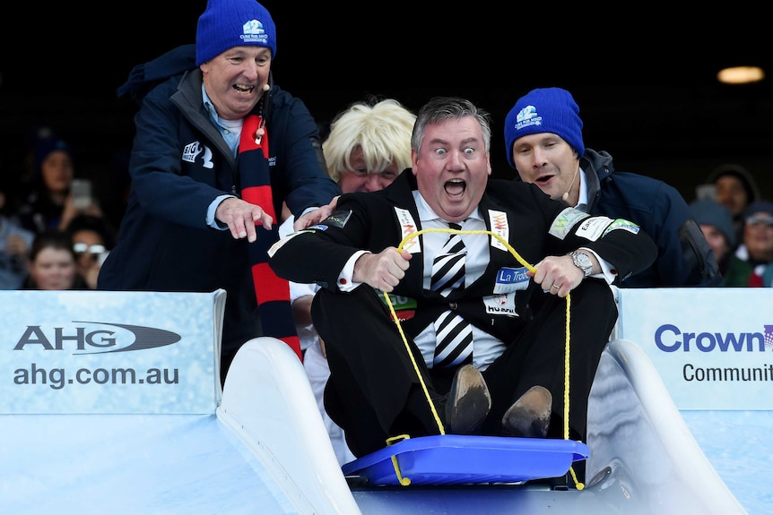 Eddie McGuire goes down the slide at Big Freeze 2