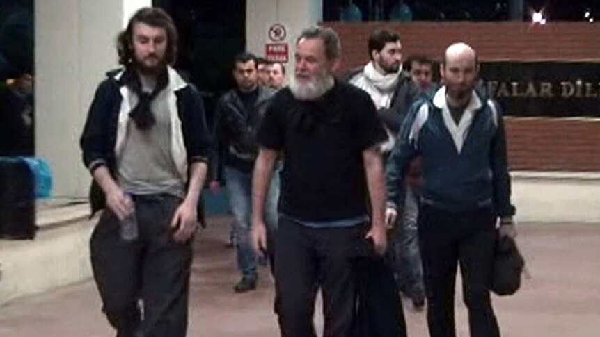 French hostages walking through an airport.