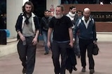 French hostages walking through an airport.
