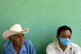 A father and son wait to be attended to at the General Hospital in Cancun