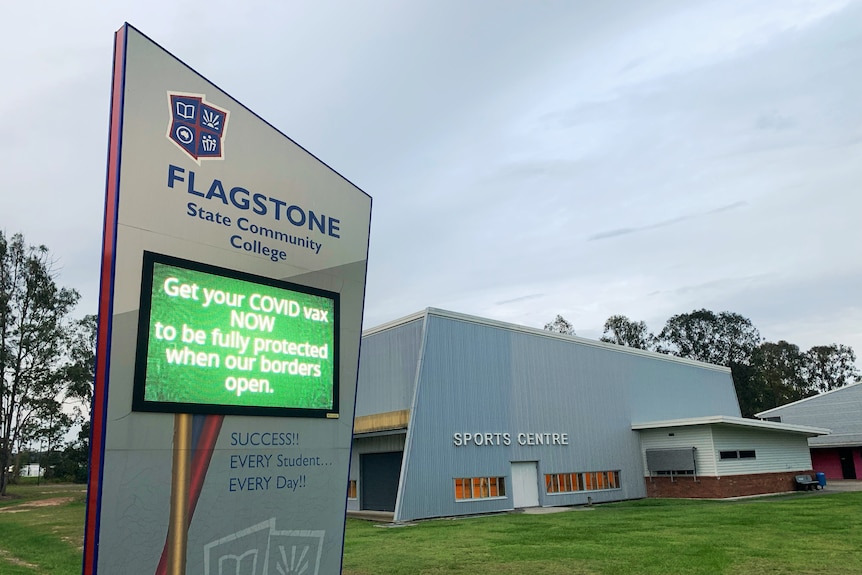 Flagstone State Community College, south of Brisbane, with COVID-19 vaccination sign.