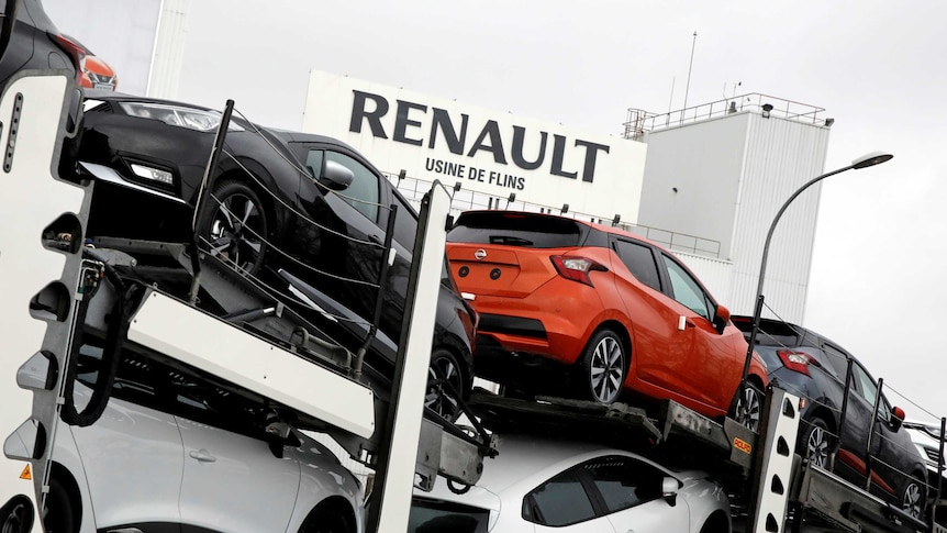 Renault and Nissan automobiles are loaded onto a transporter at the Renault SA car factory in Flins, France.