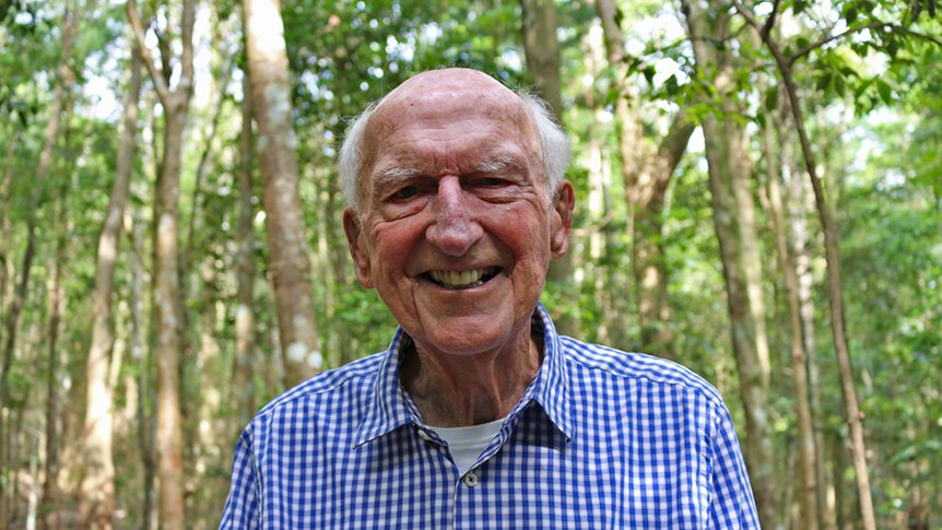 Dr Tony Parkes stands in the Big Scrub rainforest restored on his property.