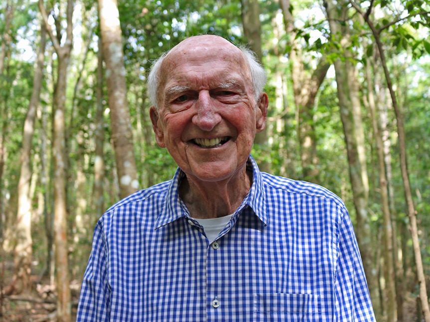 Dr Tony Parkes stands in the Big Scrub rainforest restored on his property.