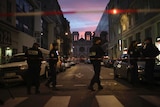 Police work behind a restricted zone near the Notre Dame church in Nice, France.