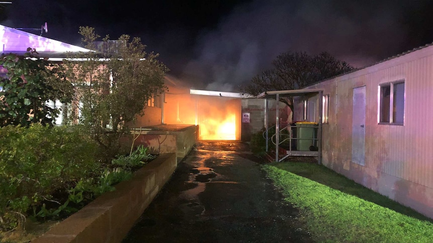 A fire at a school at night.