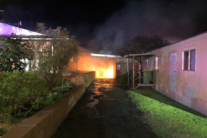 A fire at a school at night.