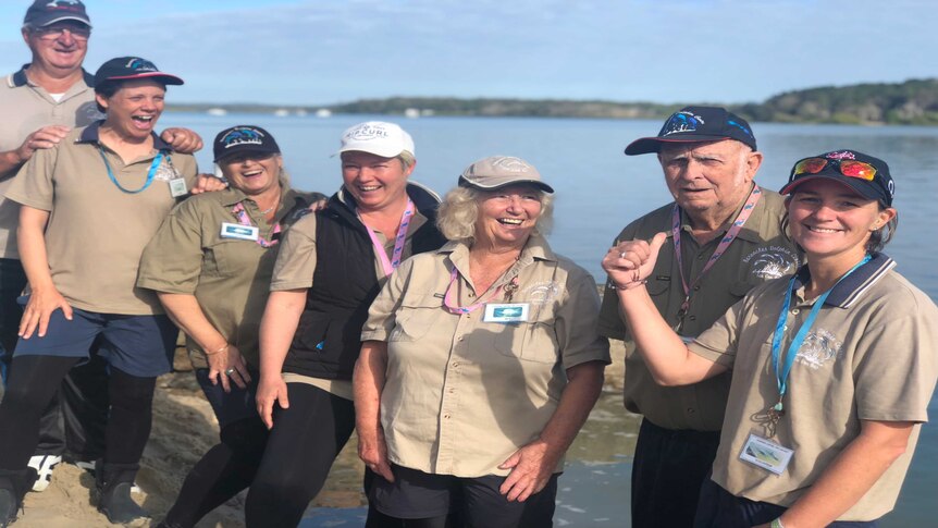 A group of volunteers standing together at Tin Can Bay Dolphin centre