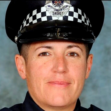 Police officer D'Arne De Leo wearing her police hat and uniform.