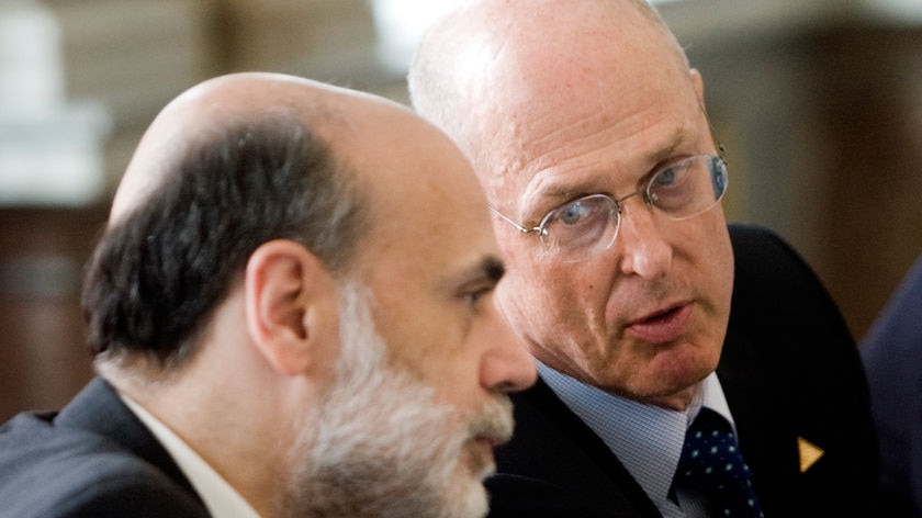 'Developing strategies': Henry Paulson (r) says the US Government will move to take ownership stakes in struggling American banks.
