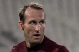 Mark Schwarzer says the Socceroos have to 'wake up to themselves' ahead of the crucial tie against Iraq.