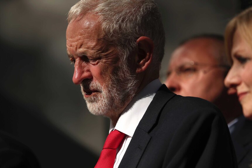 Labour leader Jeremy Corbyn wearing a suit and red tie