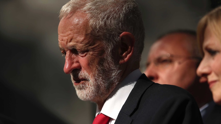 Labour leader Jeremy Corbyn wearing a suit and red tie