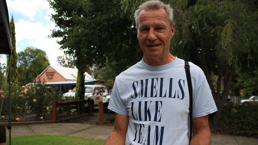 Man with T shirt and works Smells like Team Spirit