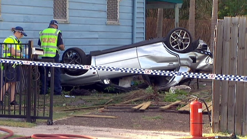 A car lies on its roof at Silkstone. (ABC TV)